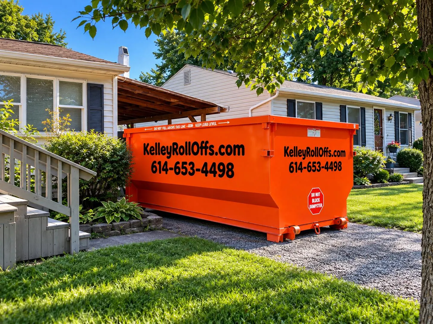 Kelley Roll-Offs orange dumpster at a home in the Columbus area